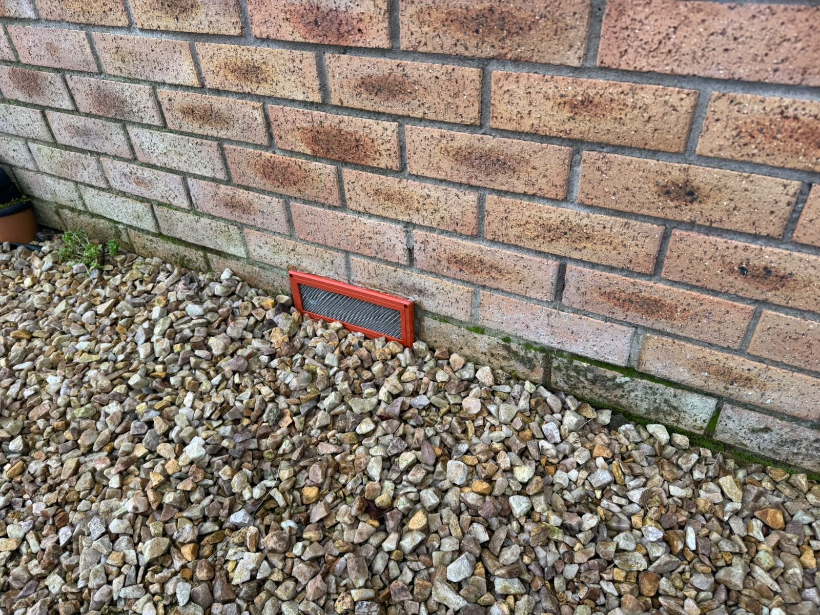 Rodent-proof air brick cover fitted to a brick wall in Glasgow