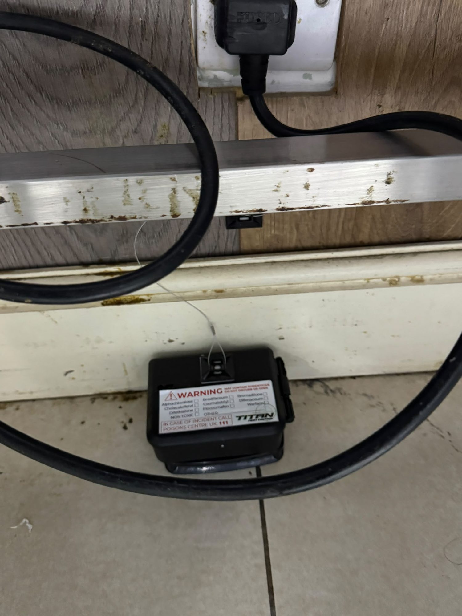 Titan rodent bait station in place in a commercial kitchen area