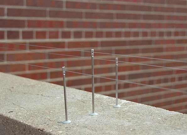 Anti-perching wire fitted to a brick ledge to stop birds landing