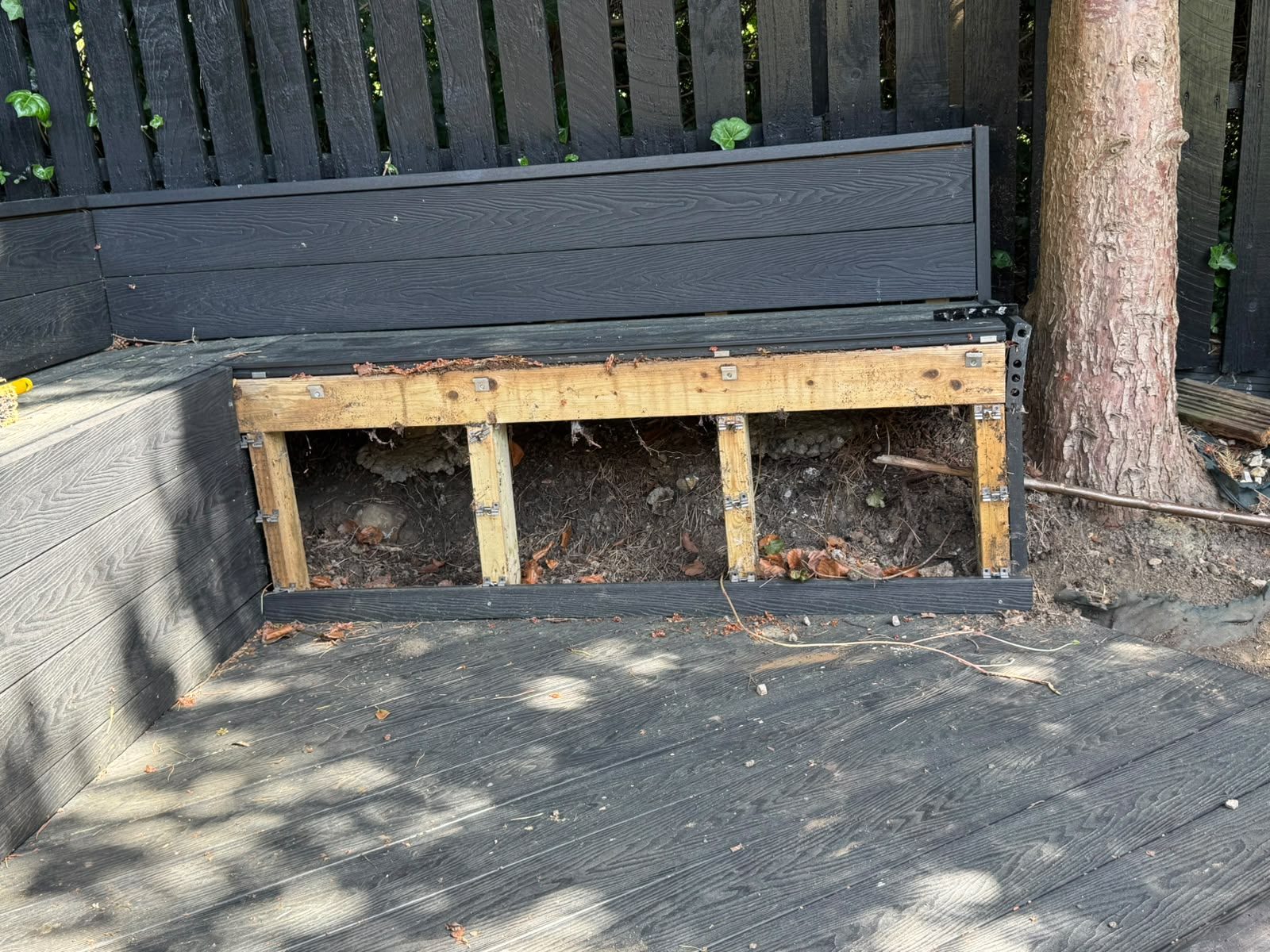 Decking panel removed to expose and proof rat harbourage beneath