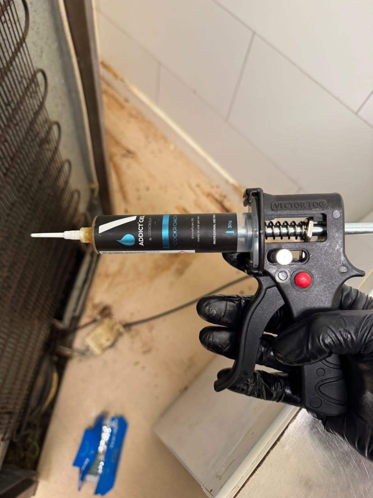 Cockroach gel bait applied beside kitchen appliances during cockroach treatment in Glasgow